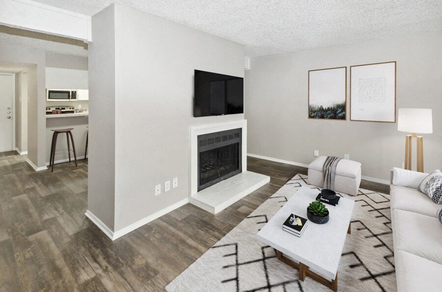 a living room with a fireplace and a table