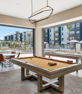 Community Clubhouse Pool Table at Glen 91 Apartments located in Glendale, AZ-SMLAM.