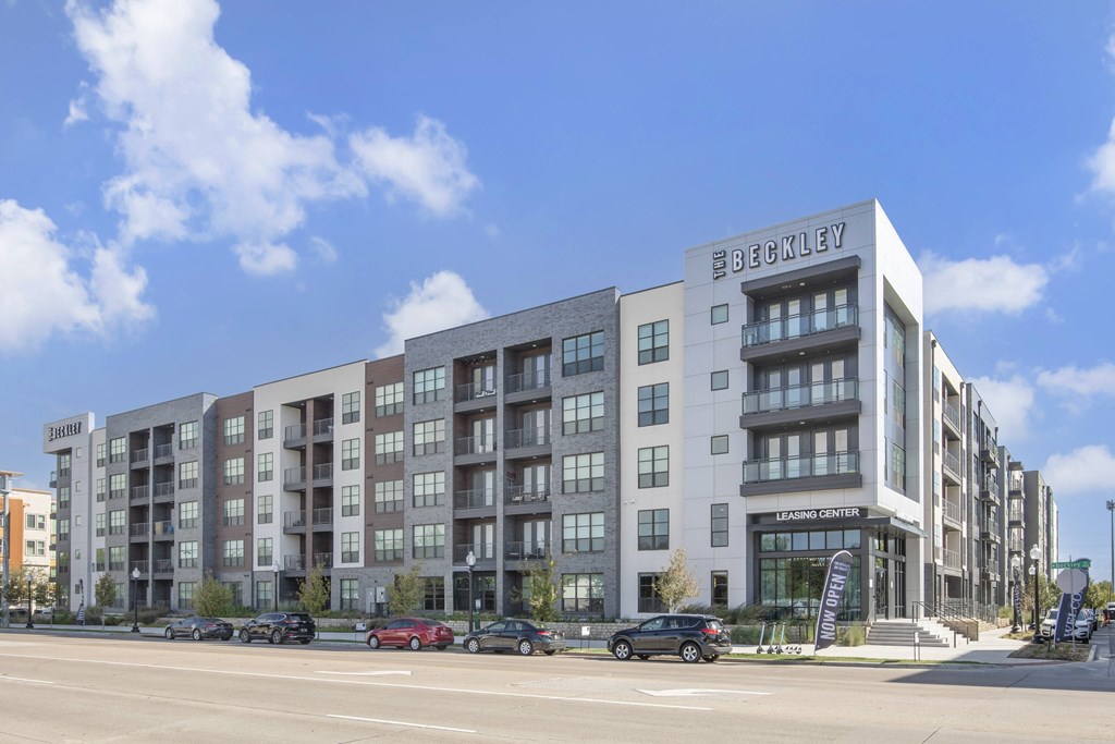 a rendering of an apartment building on a city street