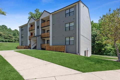 Apartment building exterior with lush greenery