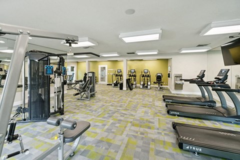Hillsboro, OR Apartments - Club at Tanasbourne - Spacious Fitness Center With Treadmills, Weight Machines, Cardio Equipment, And Bright Overhead Lighting