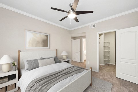 Model Bedroom with Carpet and Walk In Closet at Allure North Dallas Apartments located in Dallas, TX.