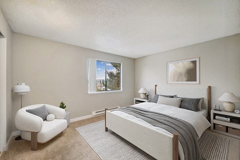 Model Bedroom with Carpet and Window View at Grammercy Apartments located in Renton, WA.