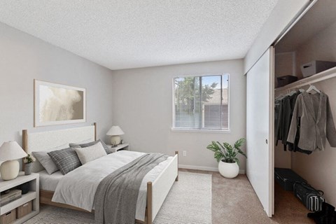 Pet-Friendly Apartments in Federal Way, WA - Sunset Three Twenty - A Bedroom With A White Bed With Gray Bedding, Two White Nightstands With Lamps, And A Window.