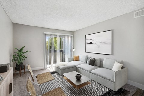 the living room of an apartment with a couch and a table
