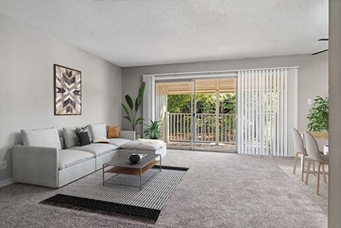 the living room of an apartment with a couch and a table