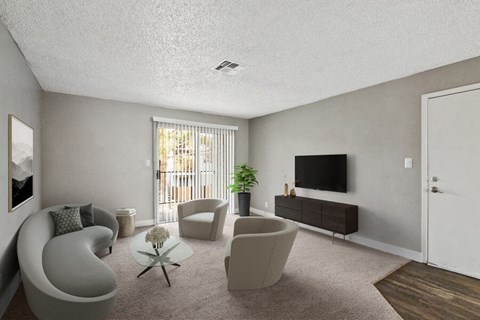 a living room with a couch and chairs and a television