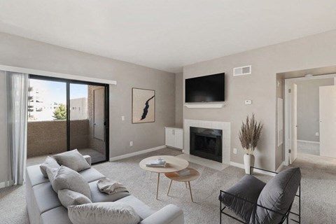 a living room with a couch and a fireplace