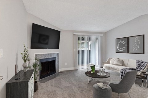 a living room with a couch and a fireplace