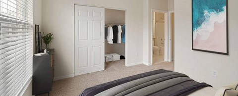 A bedroom with a bed, a dresser, and a painting on the wall.