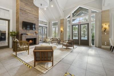 Resident clubhouse lounge with fireplace and tv