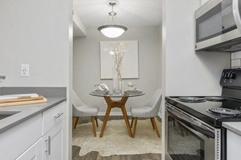 Model kitchen with view of dining area - Photo Gallery 4