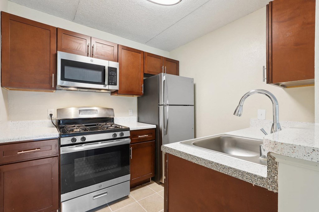 a kitchen with stainless steel appliances and a sink