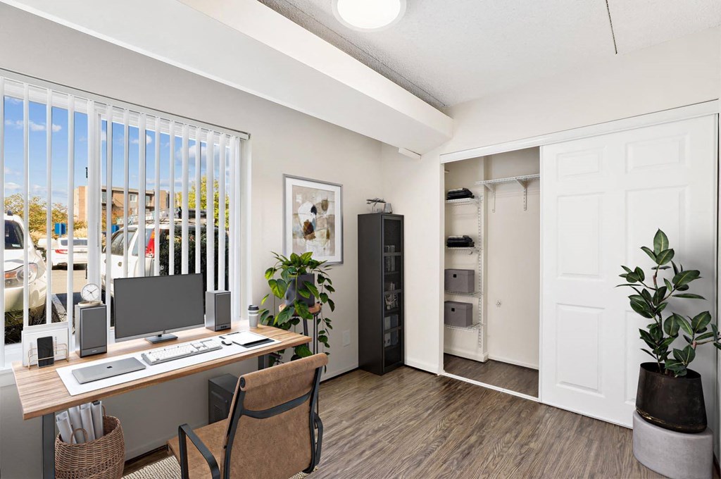 a home office with a desk and a computer