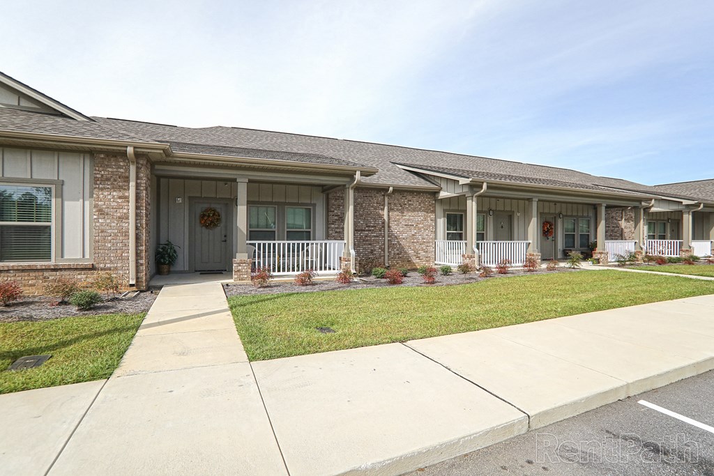 a house with a sidewalk in front of it