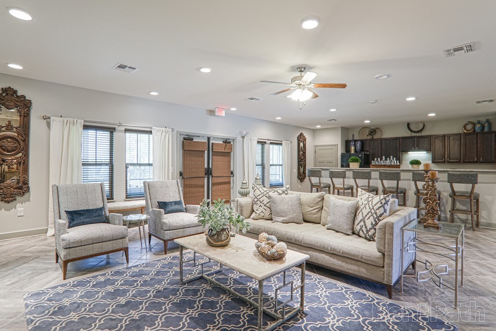 a living room with couches and chairs and a coffee table