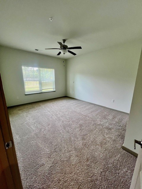 A room with a ceiling fan and carpeted floor.at Arbours at Moores Mill, Alabama