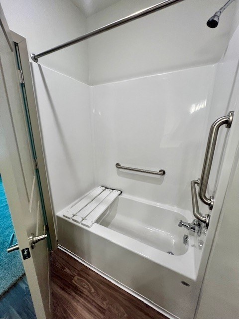 A white bathroom with a walk in shower.at Arbours at Moores Mill, Huntsville Alabama