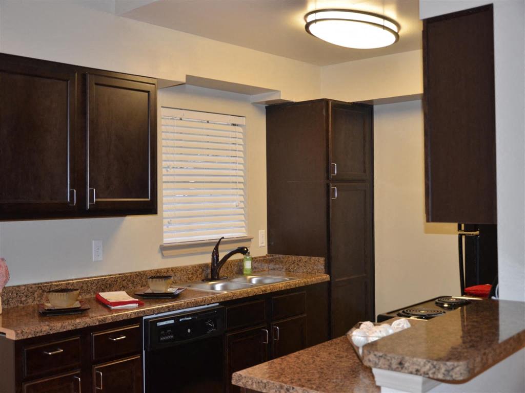 a kitchen with a sink and a counter top
