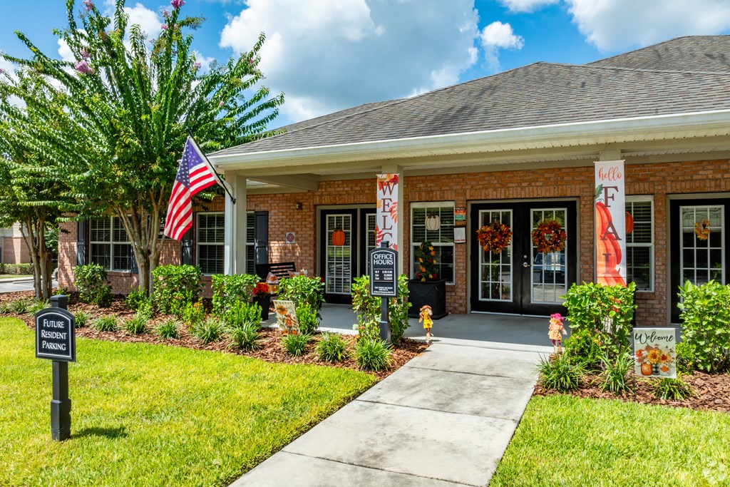 A building with a sign that says "Welcome" in front of it.