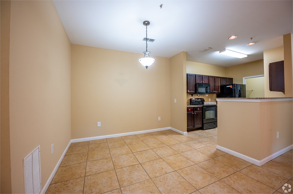 A kitchen area with a counter and appliances.