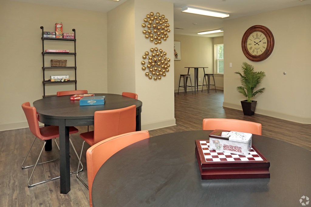 A dining room with a round table and chairs at Arbours at Tumblin Creek ~ Active 55+ Adult Community, Gainesville, FL