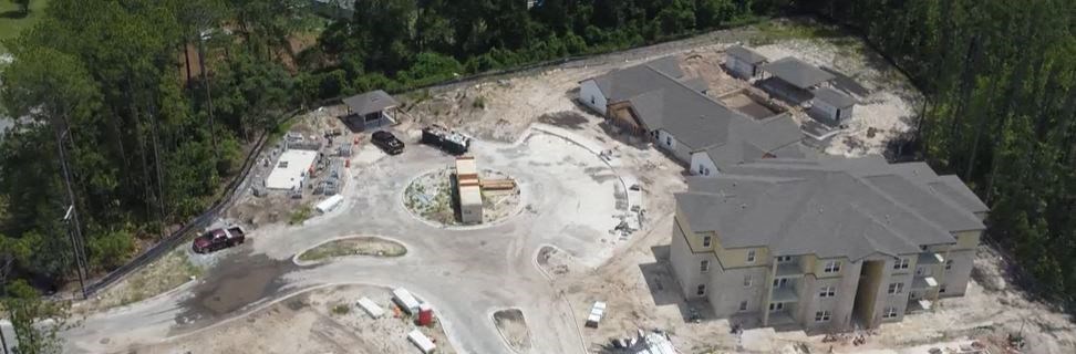an aerial view of a house being remodeled in the middle of a construction site