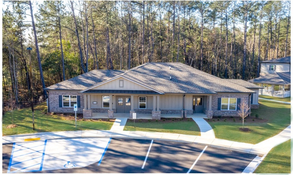 A house with a parking lot in front of it at Arbours at Satsuma Apartments, Mobile, Alabama