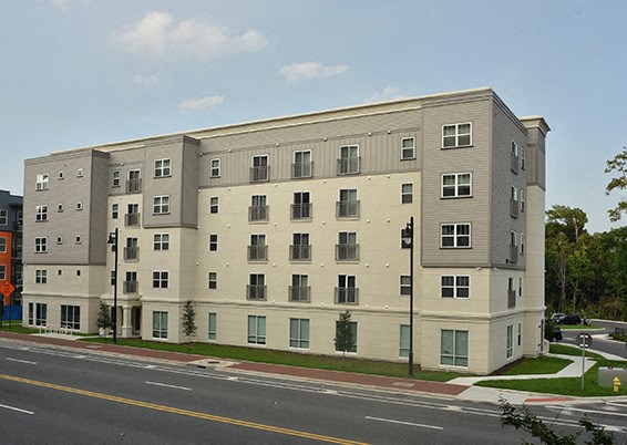 a large apartment building on the side of a street