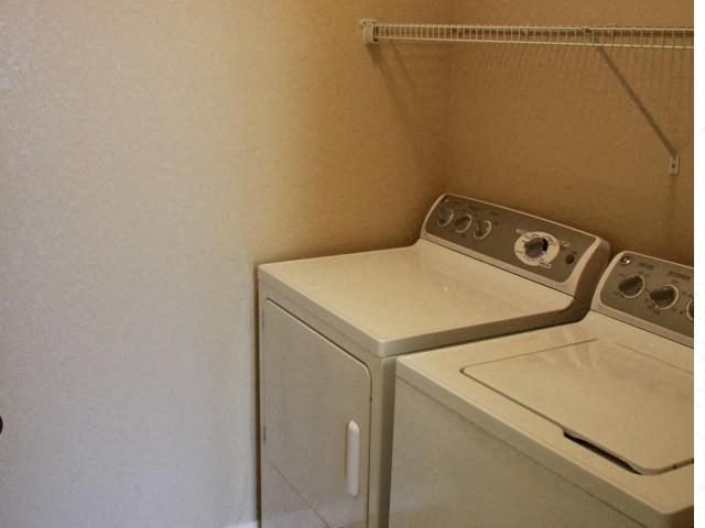 a white washer and dryer in a white room