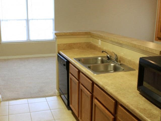 a kitchen with a sink and a dishwasher