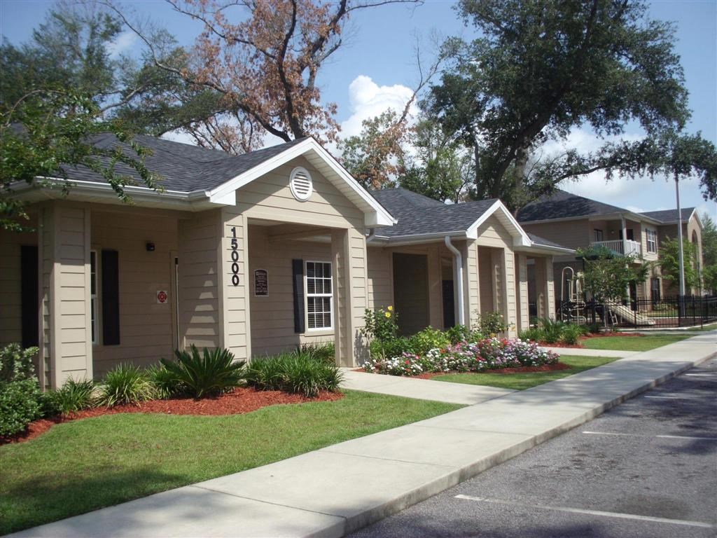a group of houses on the side of a street
