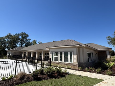 A house with a black fence in front of it at Arbours at Lake Charles, Lake Charles, 70605 