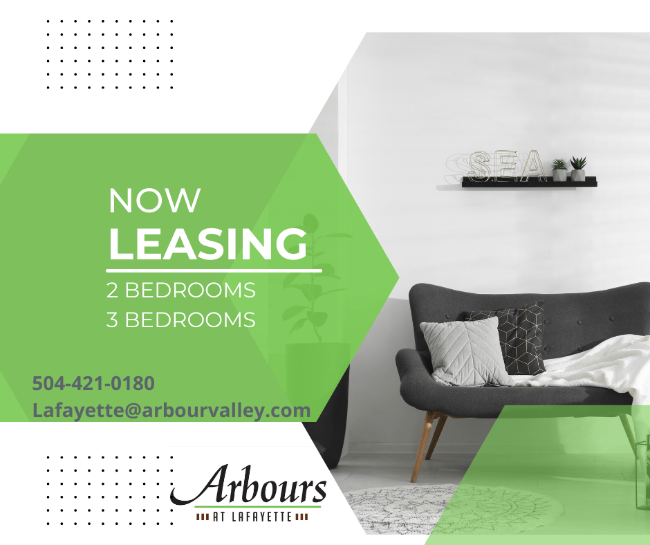 a living room with a couch and a chair and the words now leasing 2 bedrooms