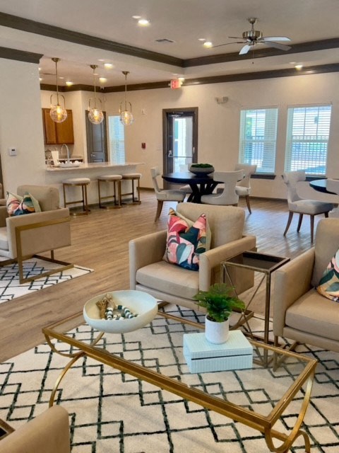 A Living Room With a White Sofa at Arbours at Quincy, Quincy, 32351
