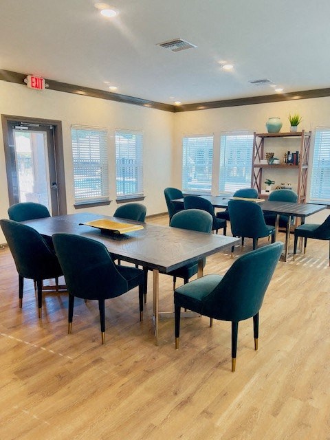 a dining room with a table and chairs