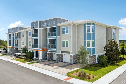 A modern apartment complex with multiple buildings and balconies.
