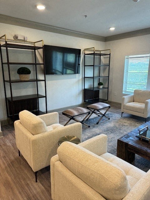 A living room with a white couch, a chair, and a coffee table.