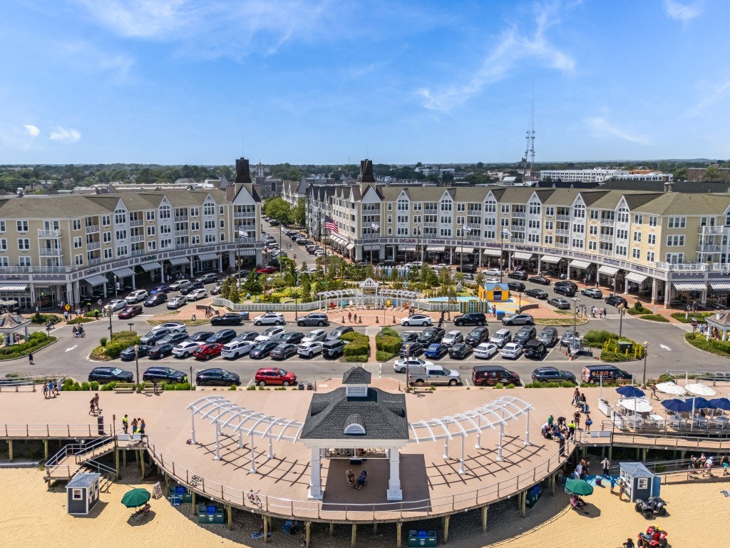 A large round building with a stage in the middle of a parking lot.