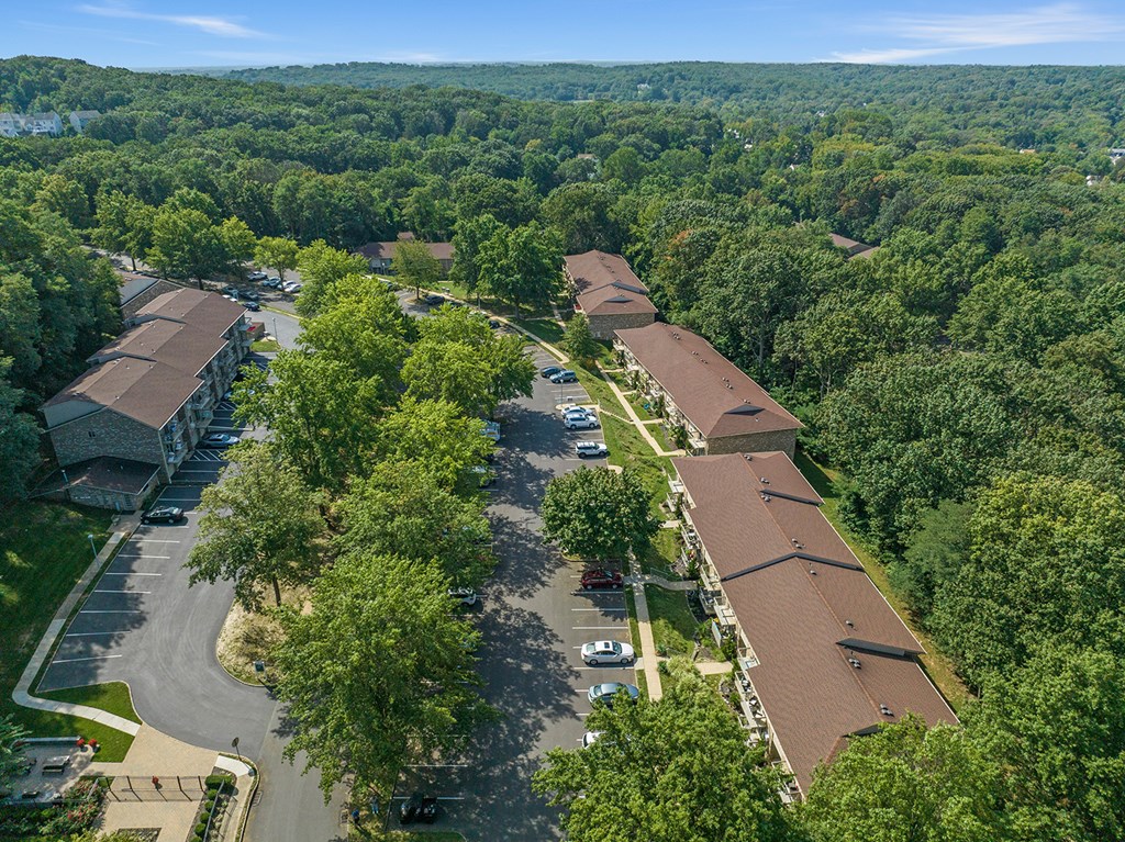 A bird's eye view of a residential area with houses and trees at Atlantic Pointe Apartments, Atlantic Highlands, NJ 07716