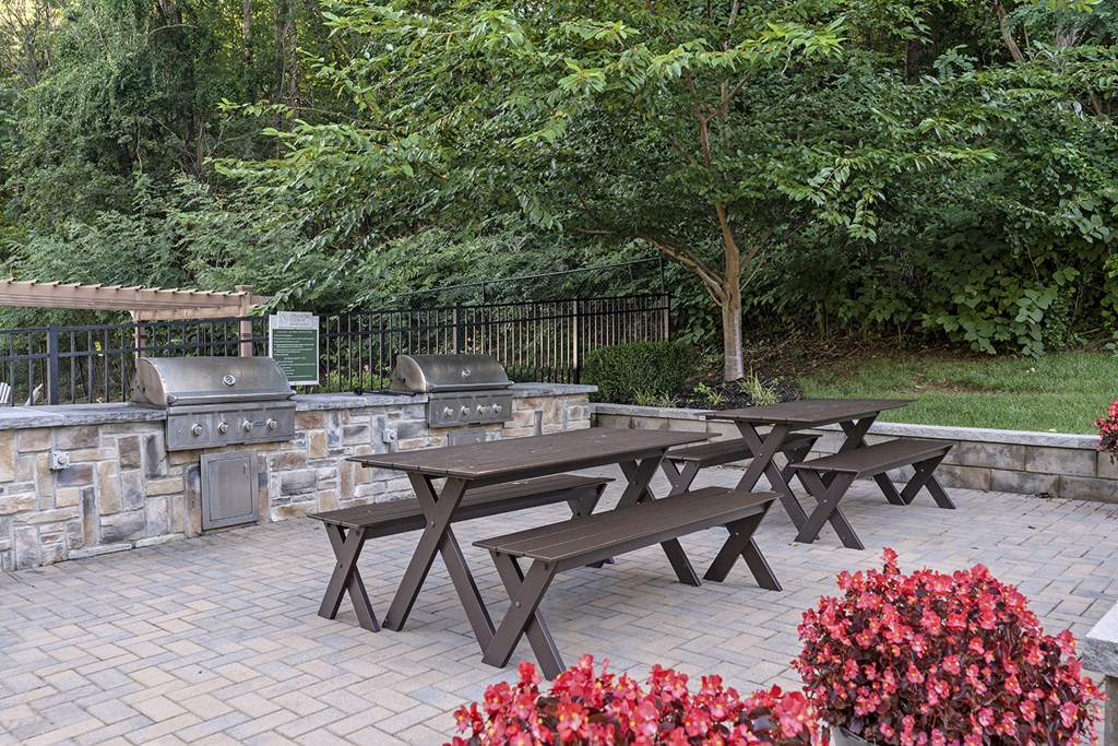Picnic tables and benches are set up in a park at Atlantic Pointe Apartments, New Jersey