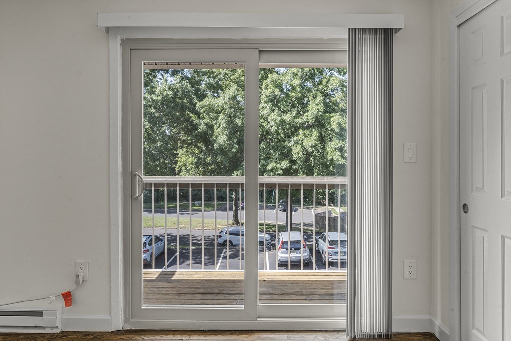 A white door with a glass window and a white frame at Atlantic Pointe Apartments, Atlantic Highlands New Jersey