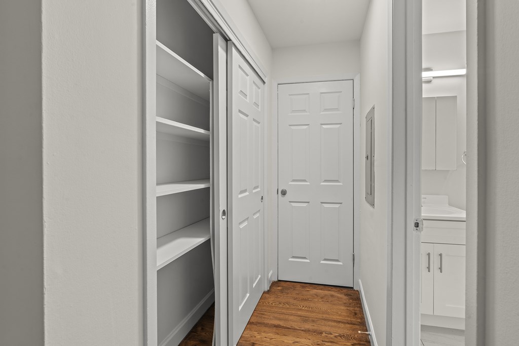 A white door is in the middle of a hallway at Atlantic Pointe Apartments, Atlantic Highlands, 07716