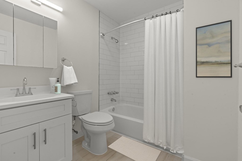 A white bathroom with a toilet at Atlantic Pointe Apartments, Atlantic Highlands, NJ 07716