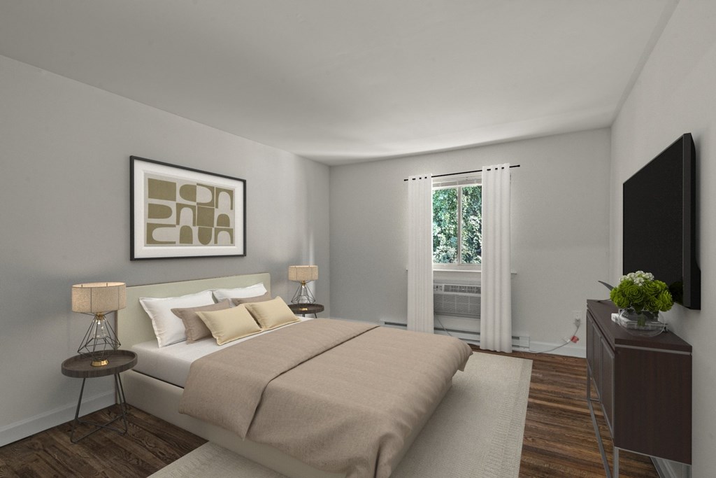 A bedroom with a bed, nightstand, and a painting on the wall at Atlantic Pointe Apartments, New Jersey 