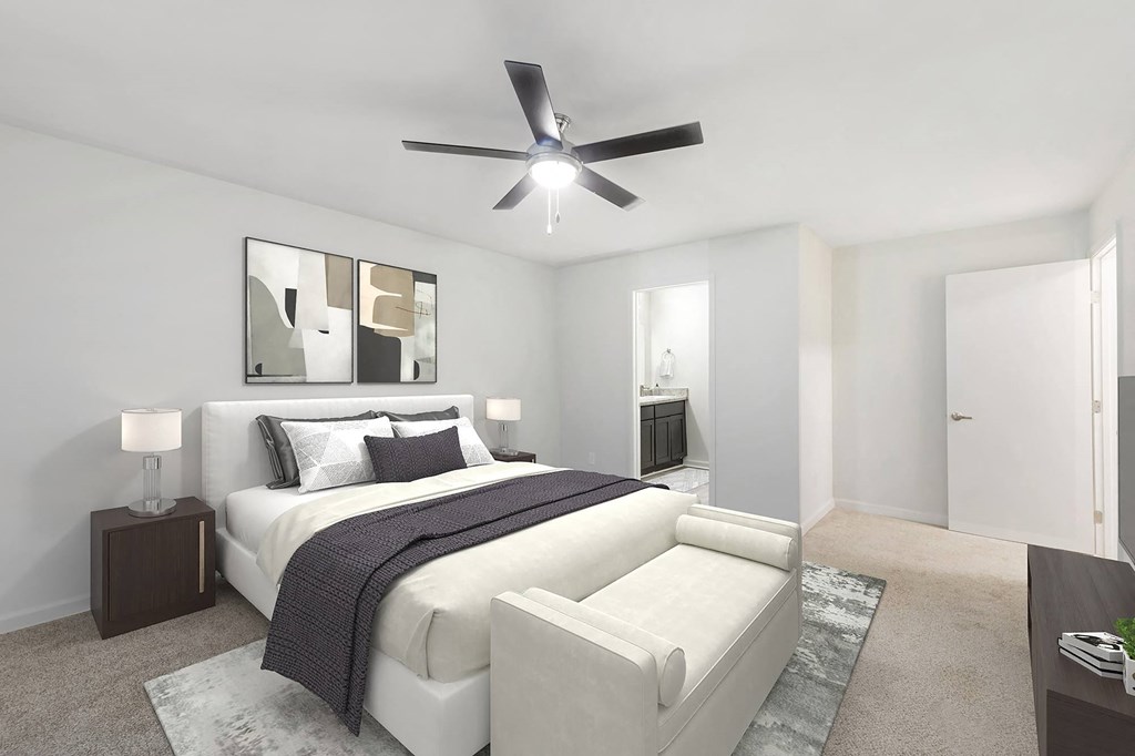 a bedroom with a bed and a ceiling fan