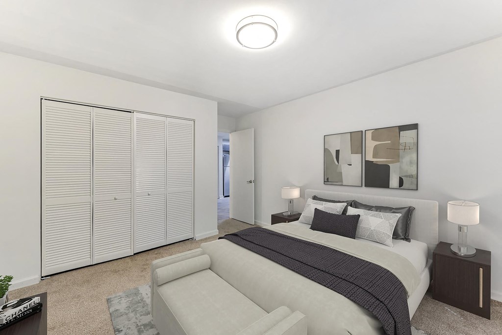 a bedroom with a bed and a couch