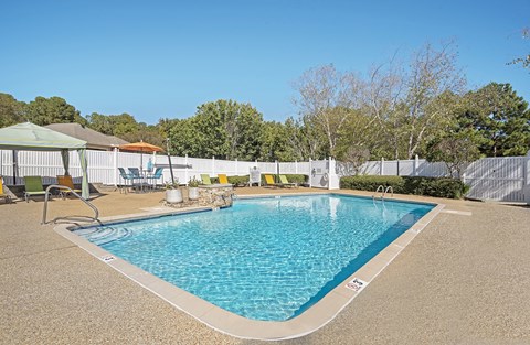 Swimming Pool with sitting area at Arbors at Natchez Trace Apartments, Ridgeland, MS