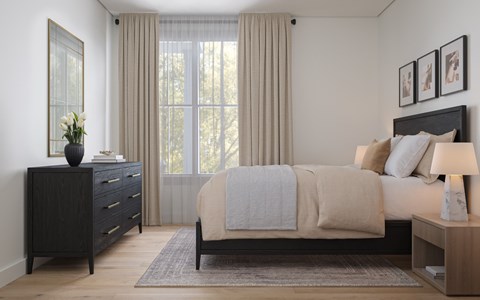 A bedroom with a bed, nightstand, and a dresser with a vase of flowers on top.