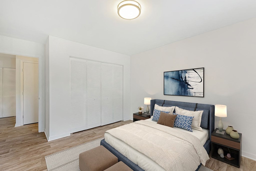 a bedroom with a large bed and a window